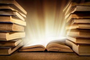 Old,Book,With,Magic,Lights,On,Vintage,Table.