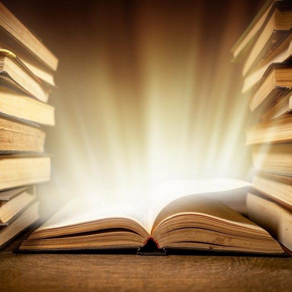 Old,Book,With,Magic,Lights,On,Vintage,Table.